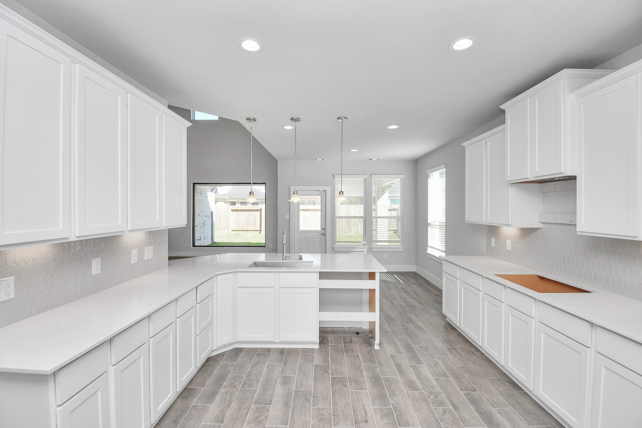 3019 Knotty Frst Drive Spring, TX 77373 - Photo 12 of 47 The open concept effortlessly connects the kitchen to the expansive family room, forming a perfect hub for gatherings. This seamless flow creates an inviting space where cooking and socializing come together harmoniously.
