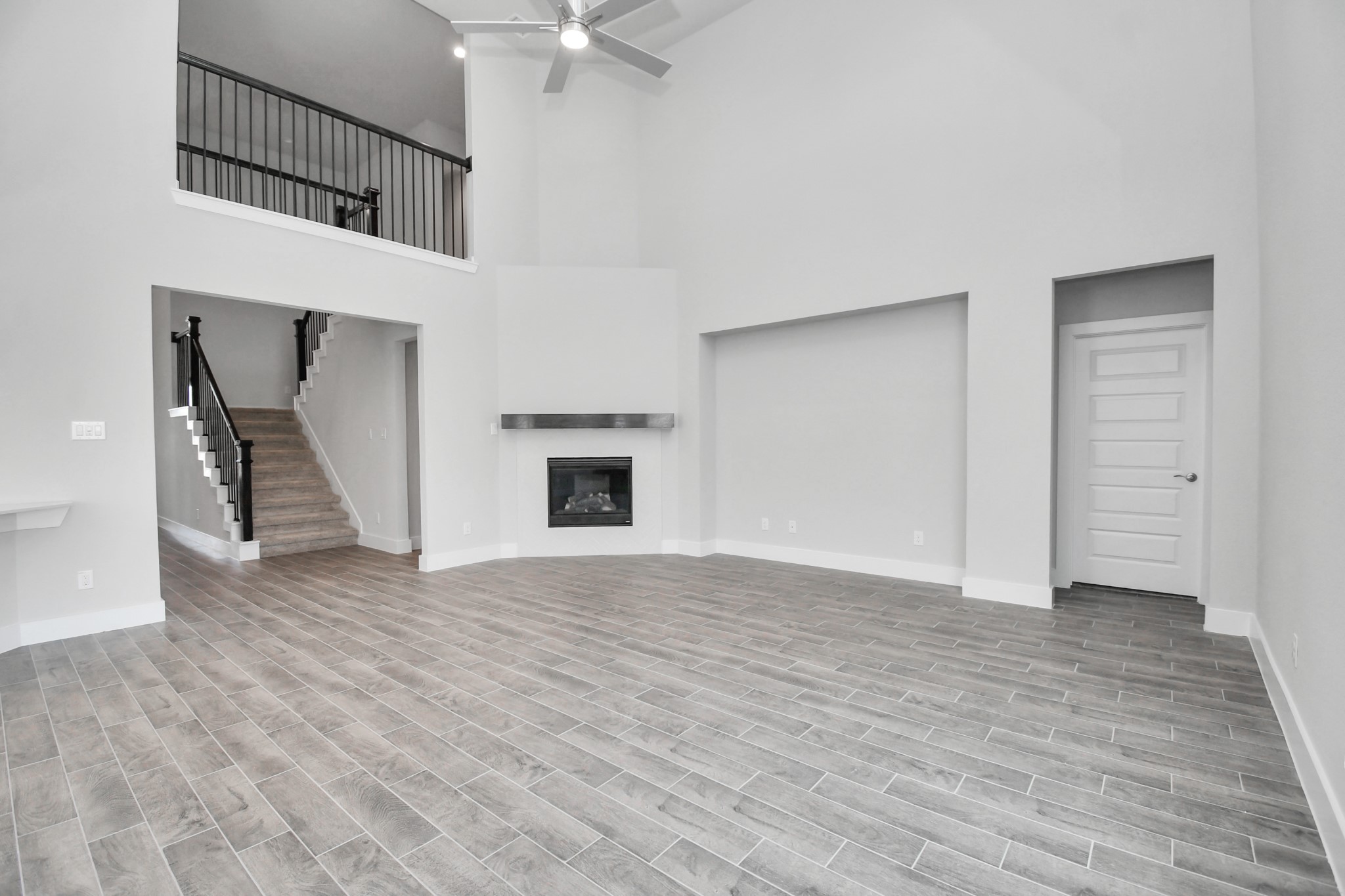 3019 Knotty Frst Drive Spring, TX 77373 - Photo 18 of 47 Gather the family and guests together in your lovely living room! Featuring soaring high ceilings, recessed lighting, ceiling fan, custom paint, gorgeous floors, and large windows that provide plenty of natural lighting throughout the day.