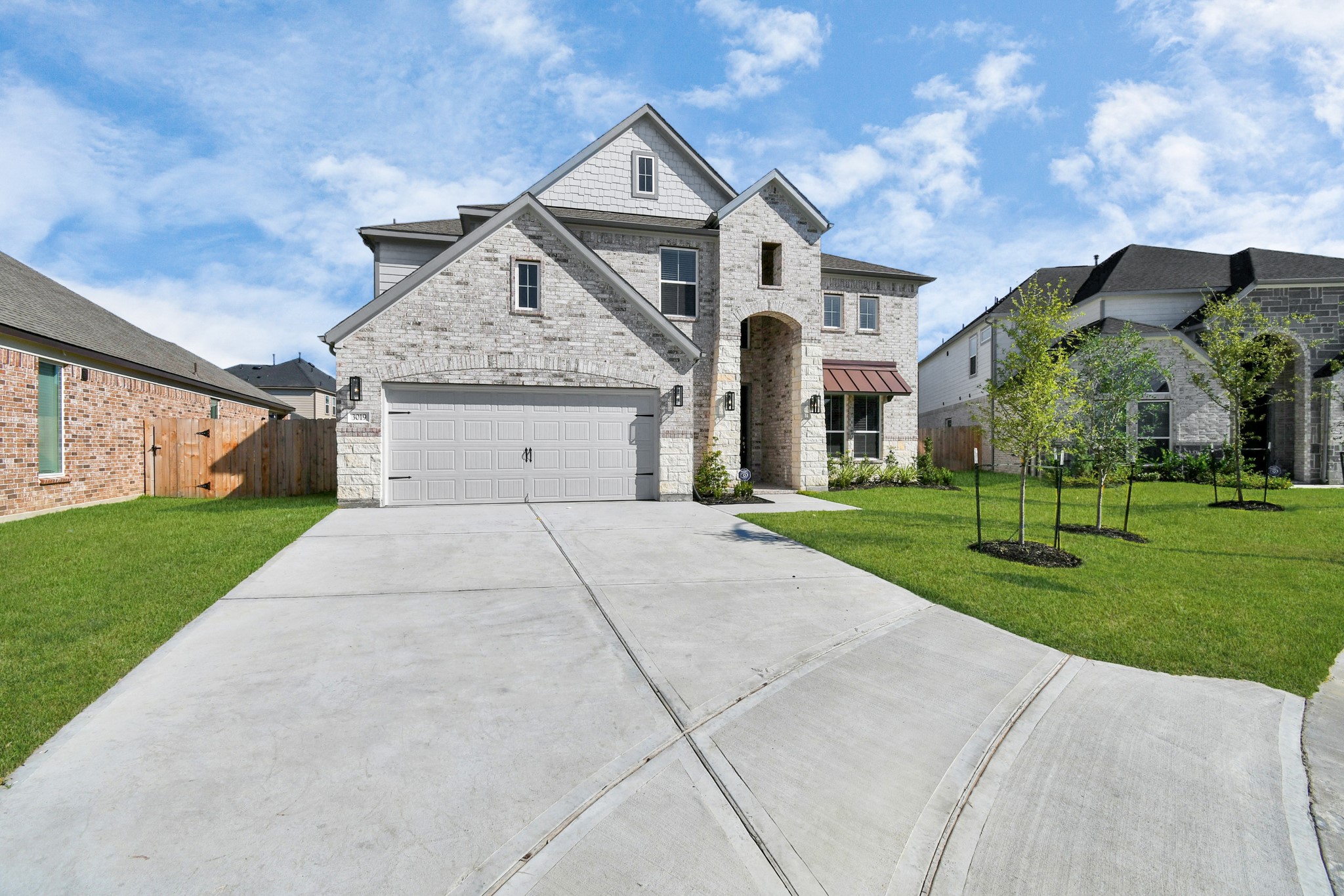 3019 Knotty Frst Drive Spring, TX 77373 - Photo 2 of 47 Home features a convenient 2-car garage complemented by a spacious driveway, offering ample parking for you and your guests.