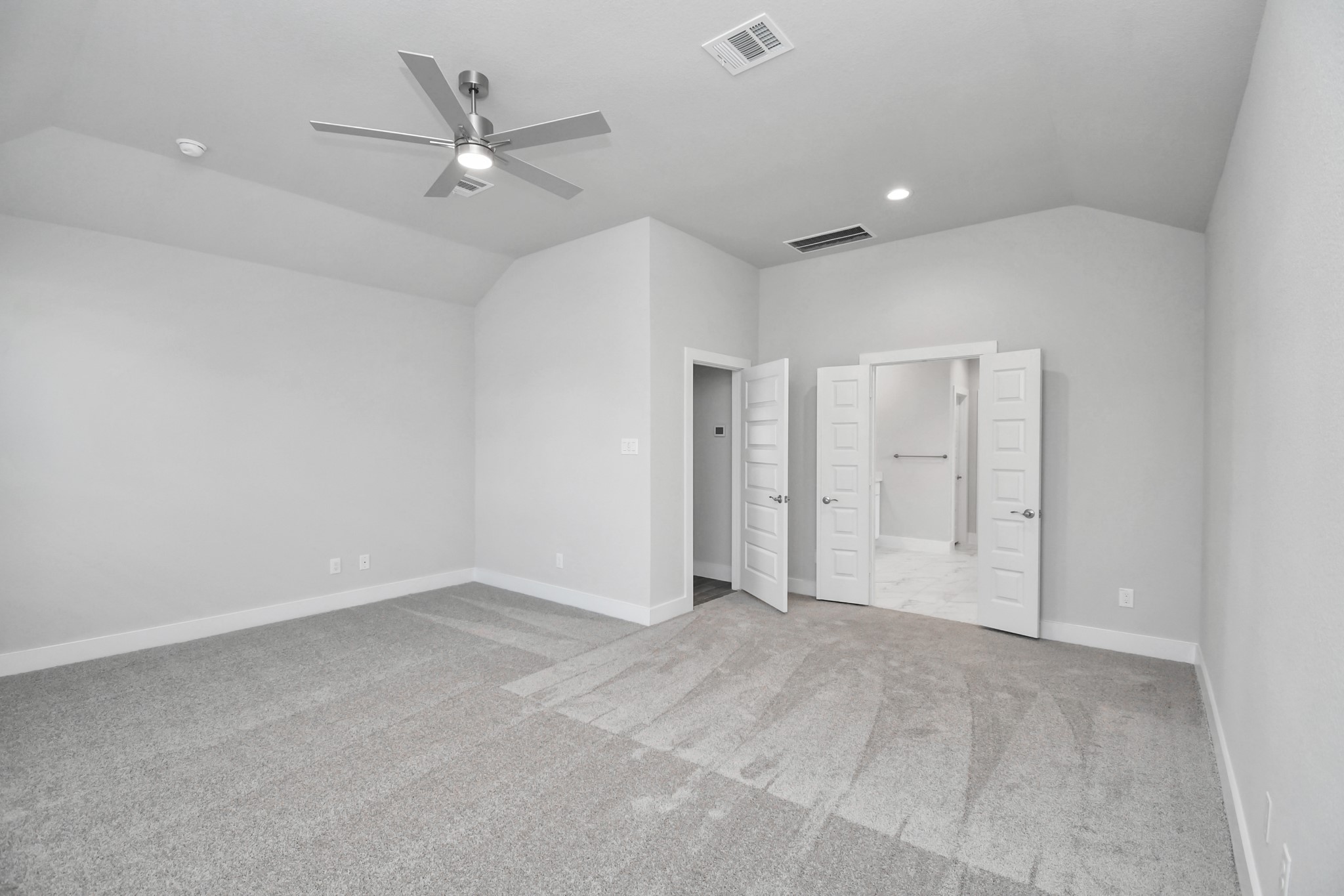 3019 Knotty Frst Drive Spring, TX 77373 - Photo 21 of 47 Come and unwind after a long day in this magnificent primary suite! This spacious room features plush carpet, warm paint, high ceilings and large windows with privacy blinds.