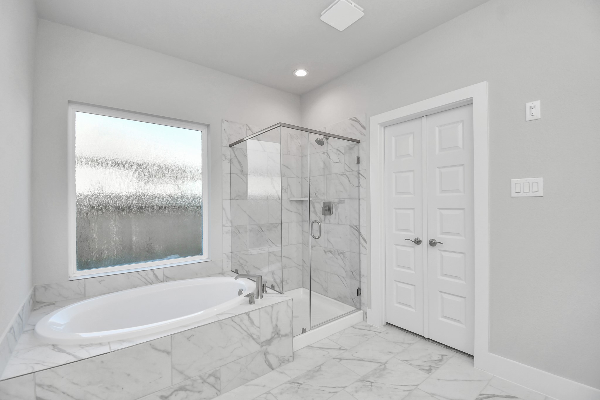 3019 Knotty Frst Drive Spring, TX 77373 - Photo 26 of 47 Indulge in a spa-like retreat within the confines of this primary bathroom. Delight in a spacious walk-in shower enveloped in stylish tile surround and unwind in a separate garden tub adorned with custom detailing.