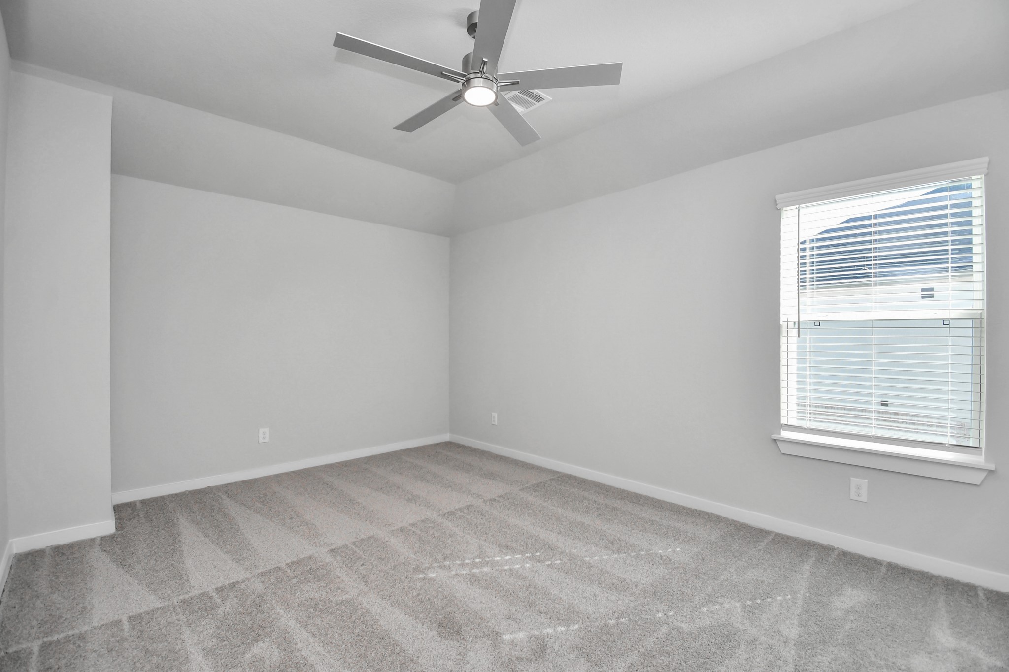 3019 Knotty Frst Drive Spring, TX 77373 - Photo 36 of 47 Secondary bedroom features plush carpeting, large windows that let in plenty of natural light, bright paint, and spacious closets.