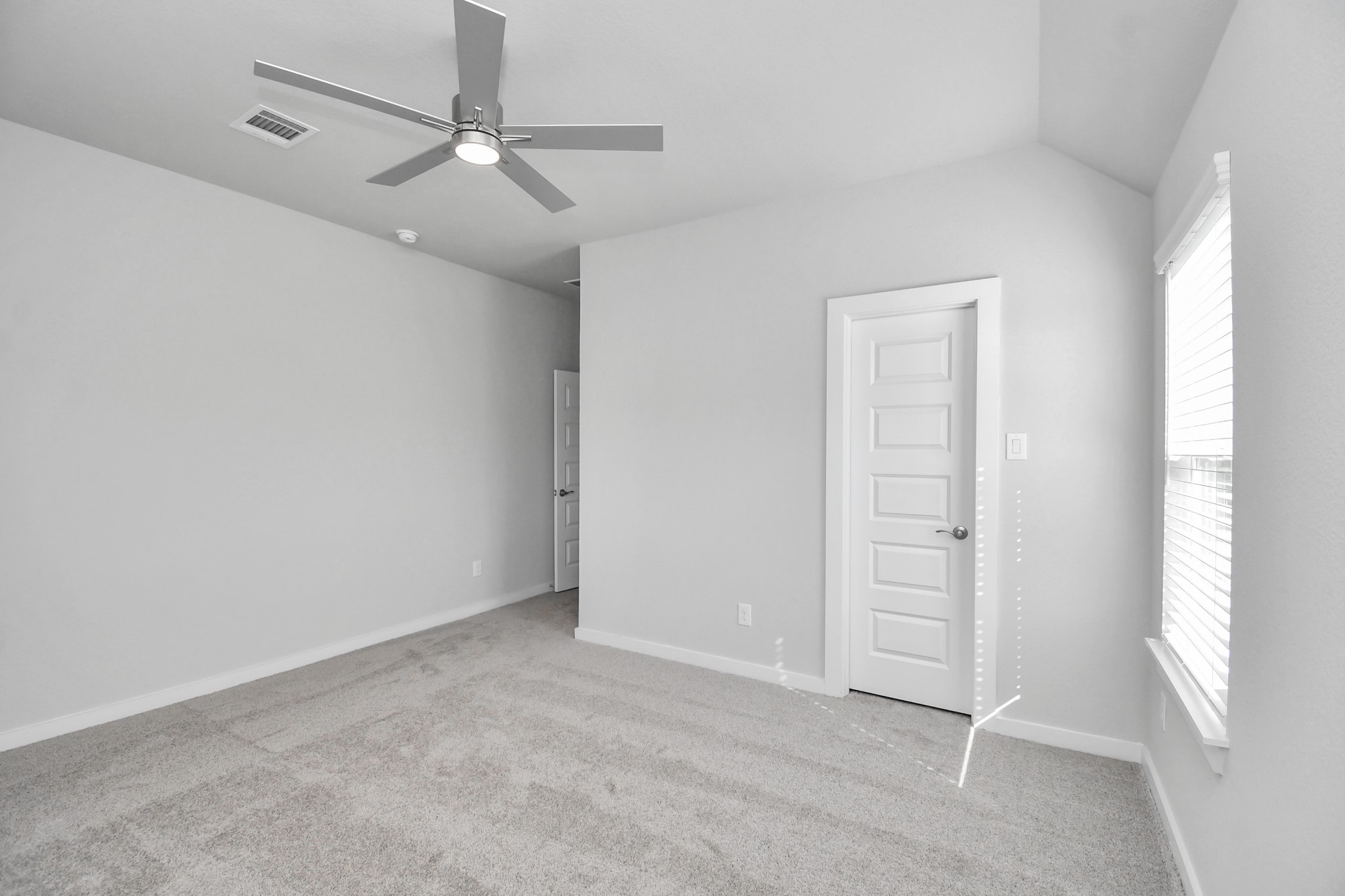 3019 Knotty Frst Drive Spring, TX 77373 - Photo 39 of 47 Secondary bedroom features plush carpeting, large windows that let in plenty of natural light, bright paint, and spacious closets.