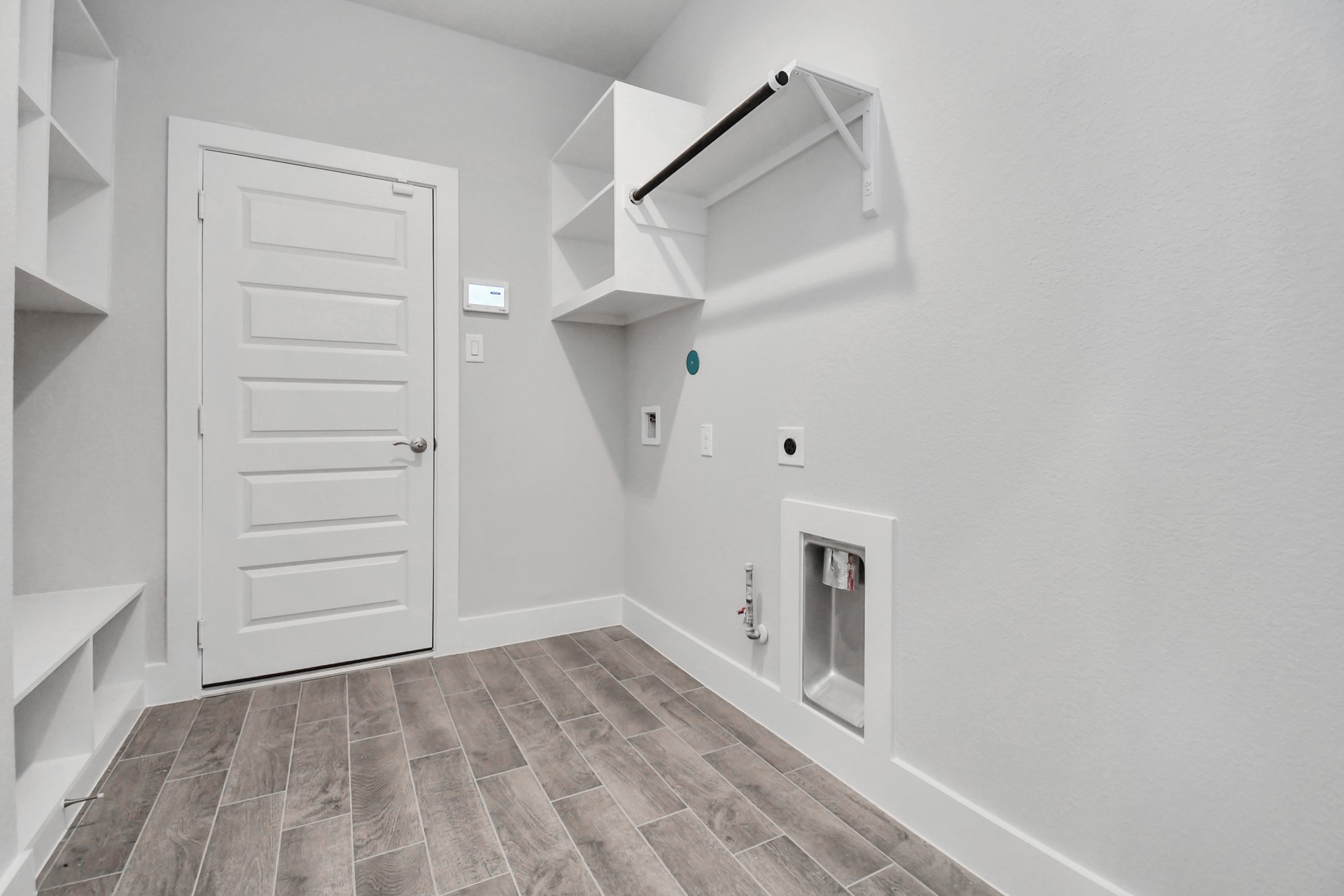 3019 Knotty Frst Drive Spring, TX 77373 - Photo 40 of 47 A perfect blend of functionality and comfort. Capture the essence of easy living with a first-floor laundry room, thoughtfully equipped with shelving for effortless organization. Both electric and gas connections available.