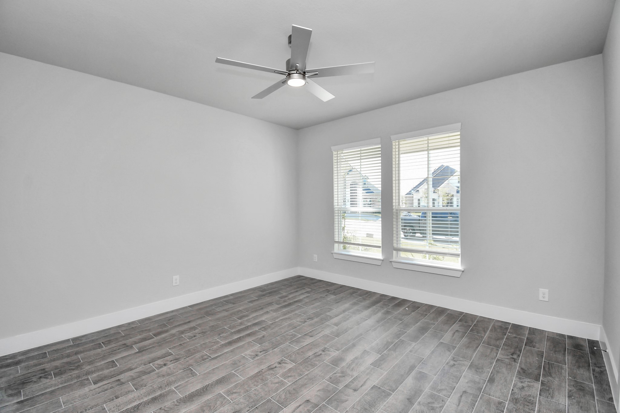 3019 Knotty Frst Drive Spring, TX 77373 - Photo 8 of 47 Step into the inviting home office, where elegant tile flooring adds a touch of freshness and comfort to the workspace. Natural light pours through the window, creating an inspiring environment for productivity and focus.