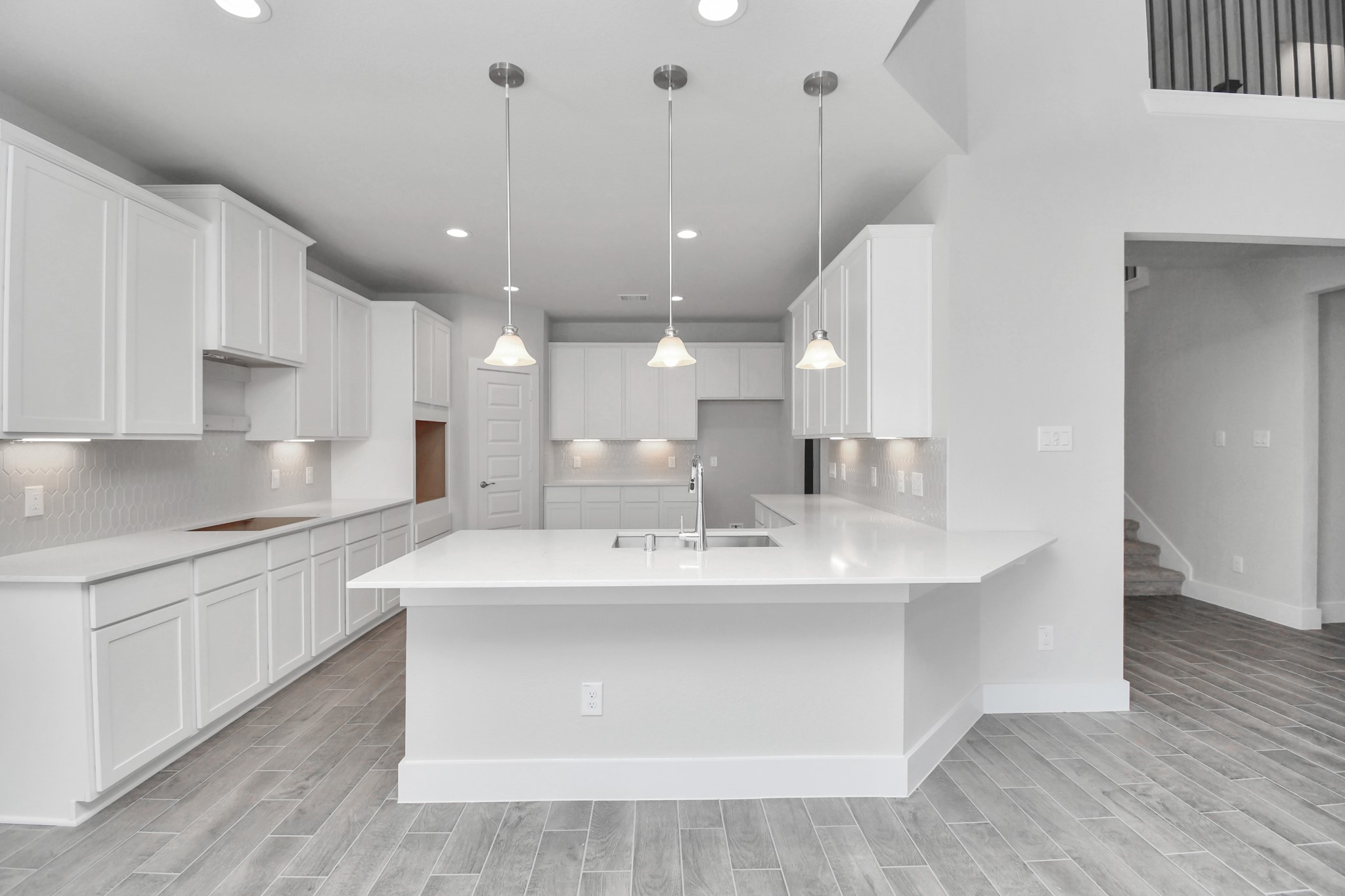 3019 Knotty Frst Drive Spring, TX 77373 - Photo 10 of 47 The kitchen is a culinary haven, featuring granite countertops, a tile backsplash, stainless steel appliances, 42” upper cabinets, and undercabinet lighting.