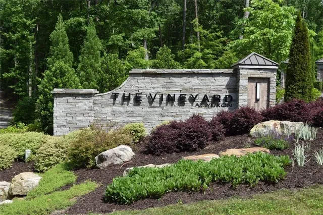 a view of house with outdoor space and sitting area