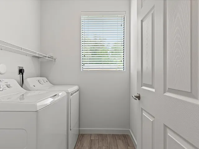 a utility room with dryer and washer