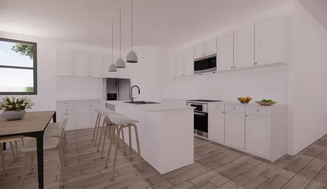 a kitchen with stainless steel appliances kitchen island granite countertop a refrigerator a stove a sink dishwasher and white cabinets with wooden floor