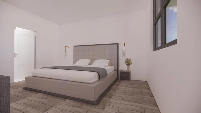 a bedroom with a bed and a mirror
