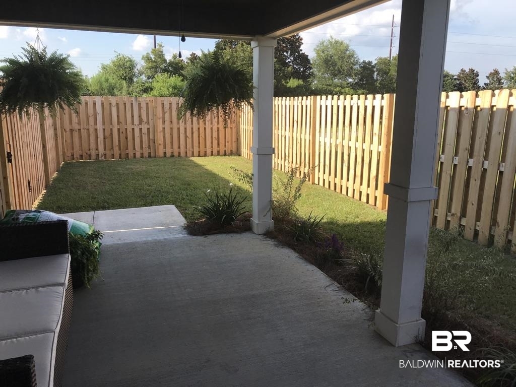 24093 Veranda Circle Elberta, AL 36530 - Photo 26 of 29 Back Porch/fenced yard ar