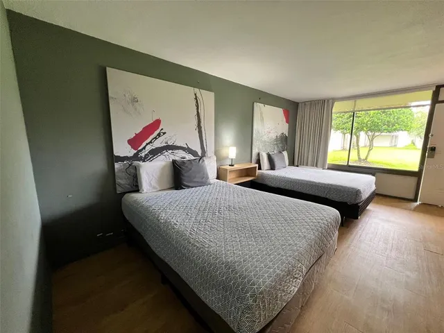 a bedroom with a bed and window
