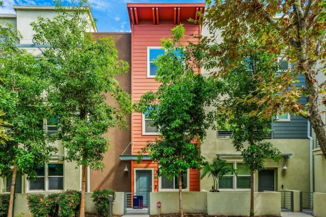 front view of a house with a tree