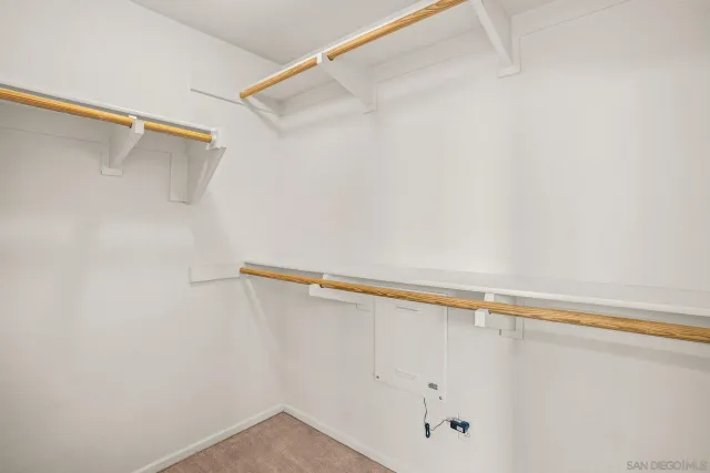 a view of a room with shelf on the wall