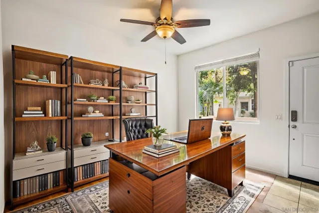 a living room with furniture a rug and a window
