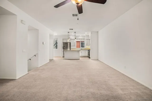 a view of a kitchen with a sink and a chandelier