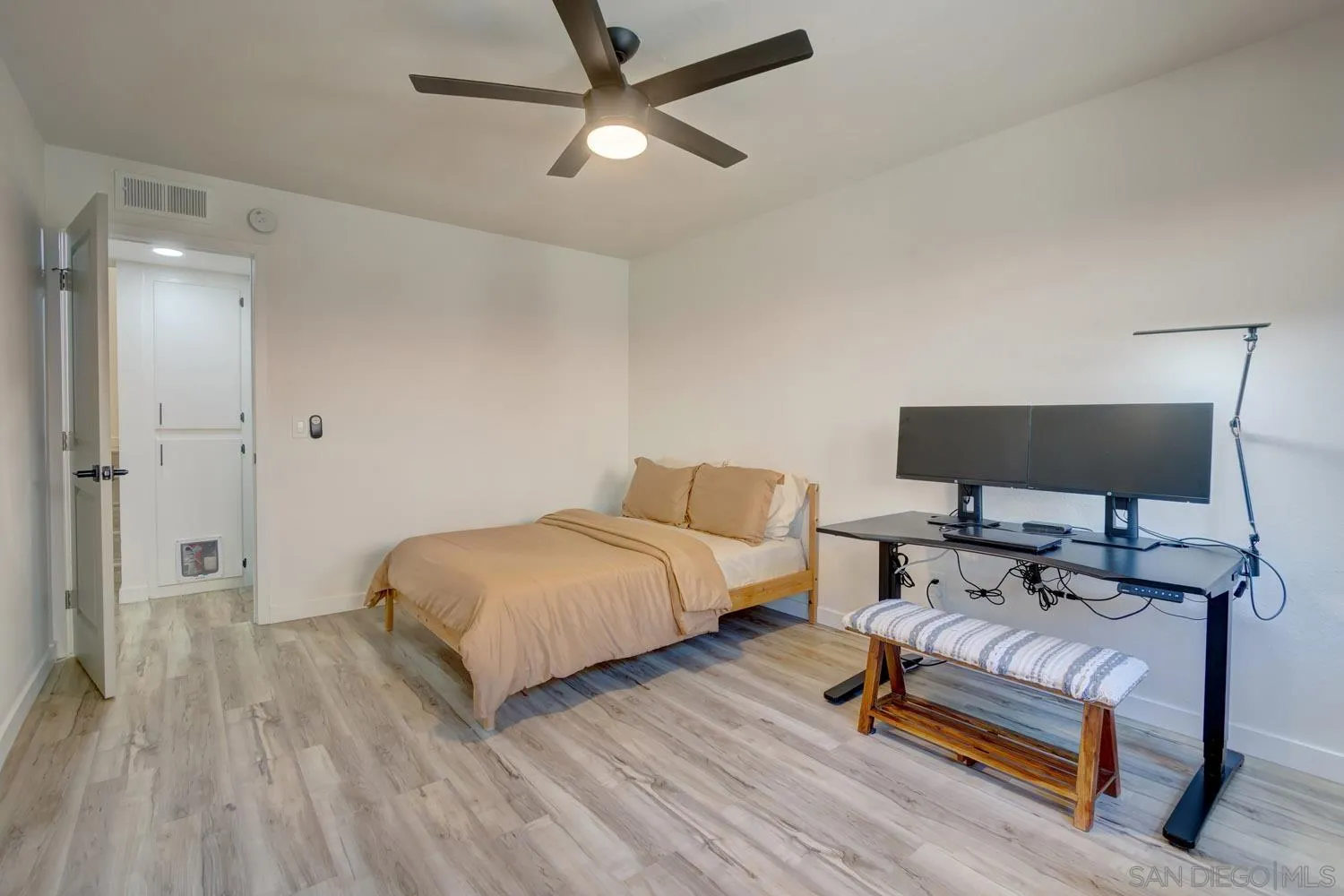 10784 Tamar Terrace, Unit C Santee, CA 92071 - Photo 13 of 33 a spacious bedroom with a bed and a flat screen tv