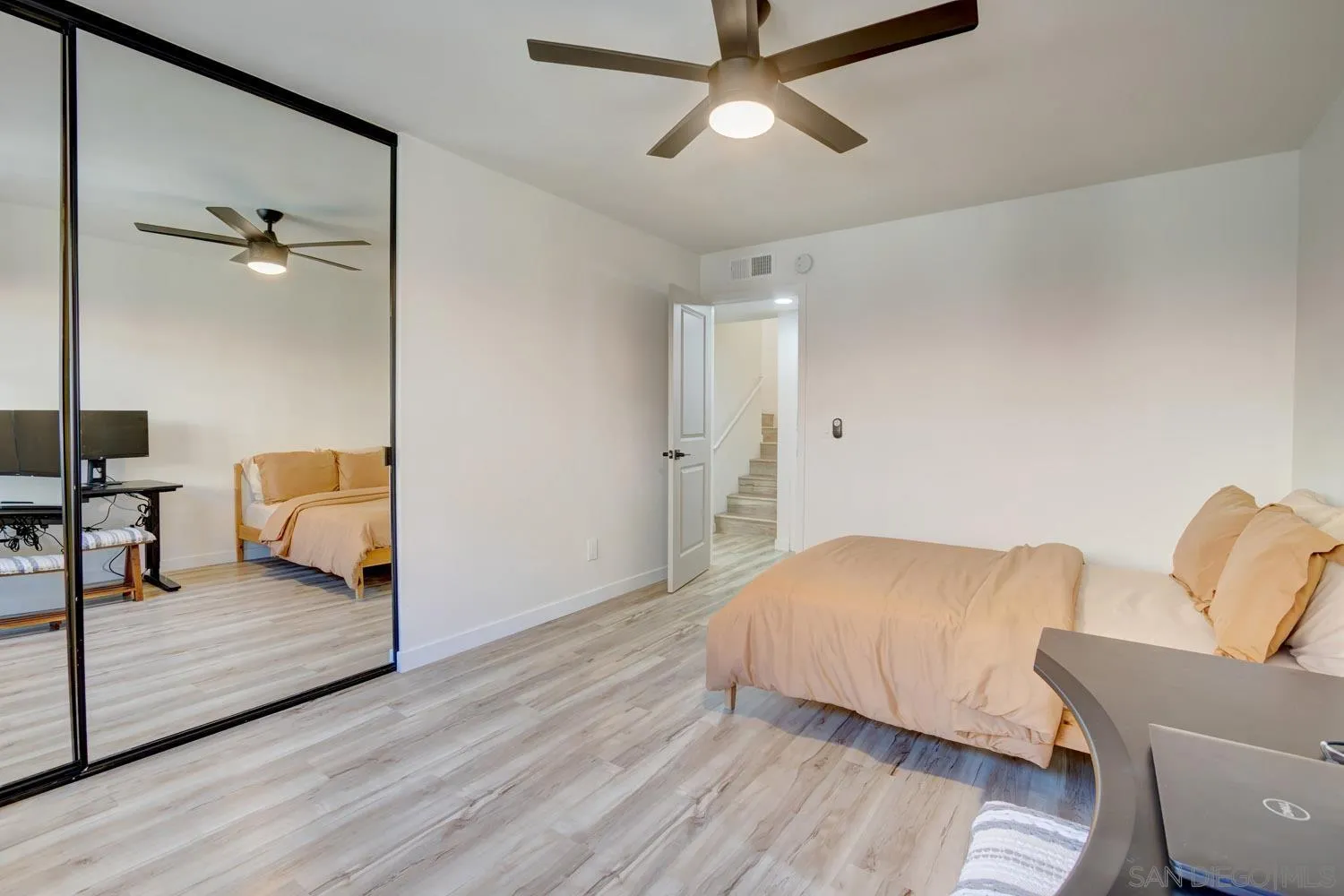 10784 Tamar Terrace, Unit C Santee, CA 92071 - Photo 14 of 33 a bedroom with a bed and lamp