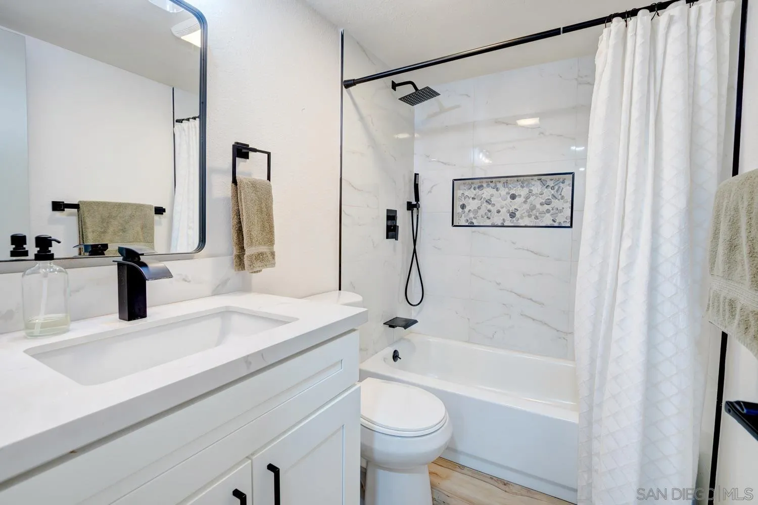 10784 Tamar Terrace, Unit C Santee, CA 92071 - Photo 15 of 33 a bathroom with a sink and a mirror