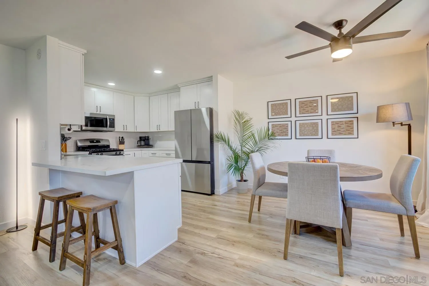 10784 Tamar Terrace, Unit C Santee, CA 92071 - Photo 20 of 33 a kitchen with furniture wooden floor and a refrigerator