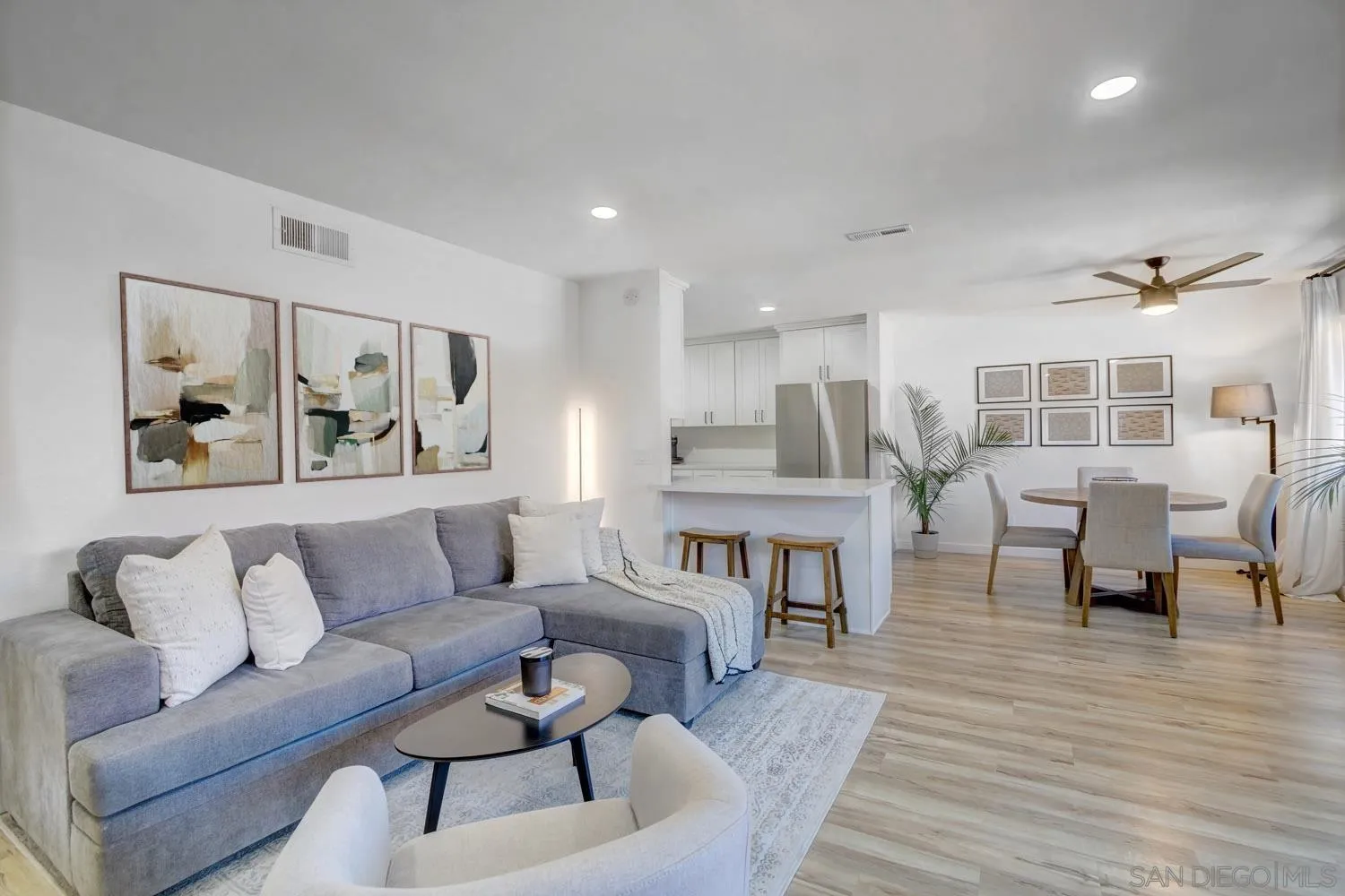 10784 Tamar Terrace, Unit C Santee, CA 92071 - Photo 2 of 33 a living room with furniture and a wooden floor