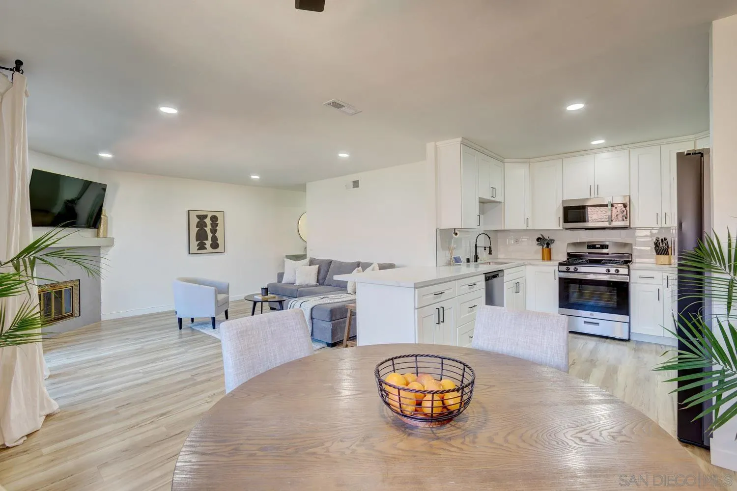 10784 Tamar Terrace, Unit C Santee, CA 92071 - Photo 24 of 33 a large white kitchen with lots of counter space and stainless steel appliances