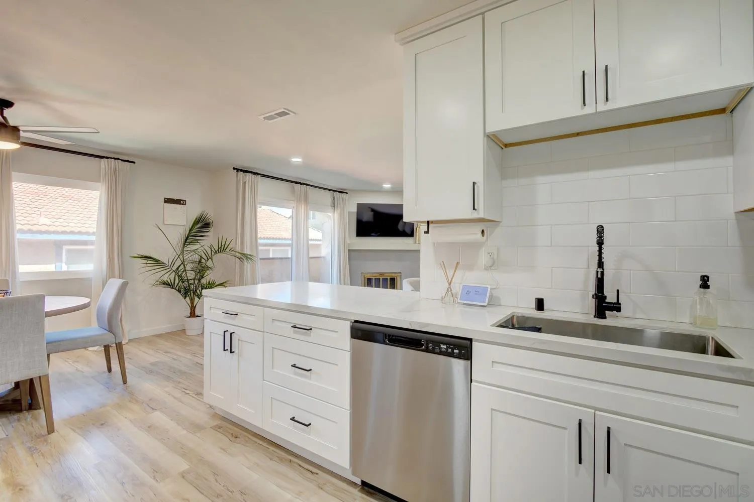 10784 Tamar Terrace, Unit C Santee, CA 92071 - Photo 25 of 33 a kitchen with white cabinets and sink