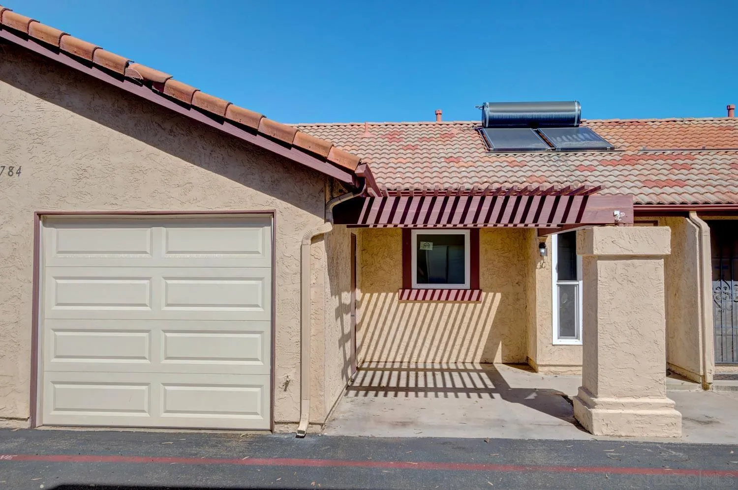 10784 Tamar Terrace, Unit C Santee, CA 92071 - Photo 30 of 33 a view of a house with a door