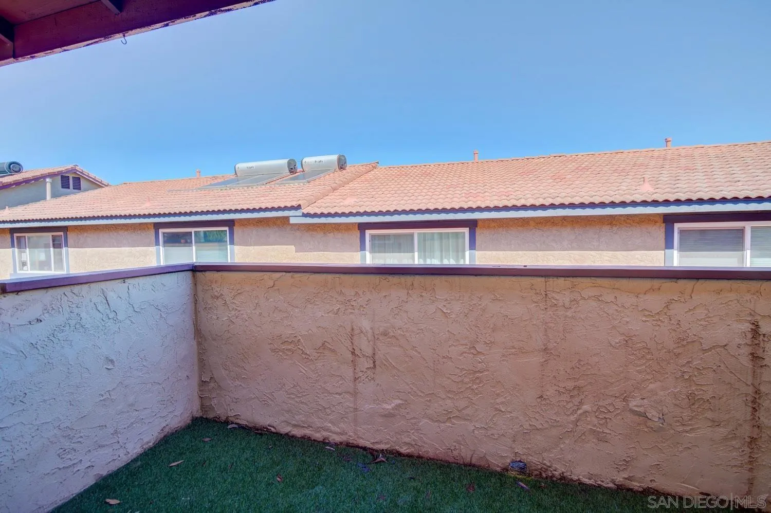 10784 Tamar Terrace, Unit C Santee, CA 92071 - Photo 32 of 33 a front view of a house with a garden