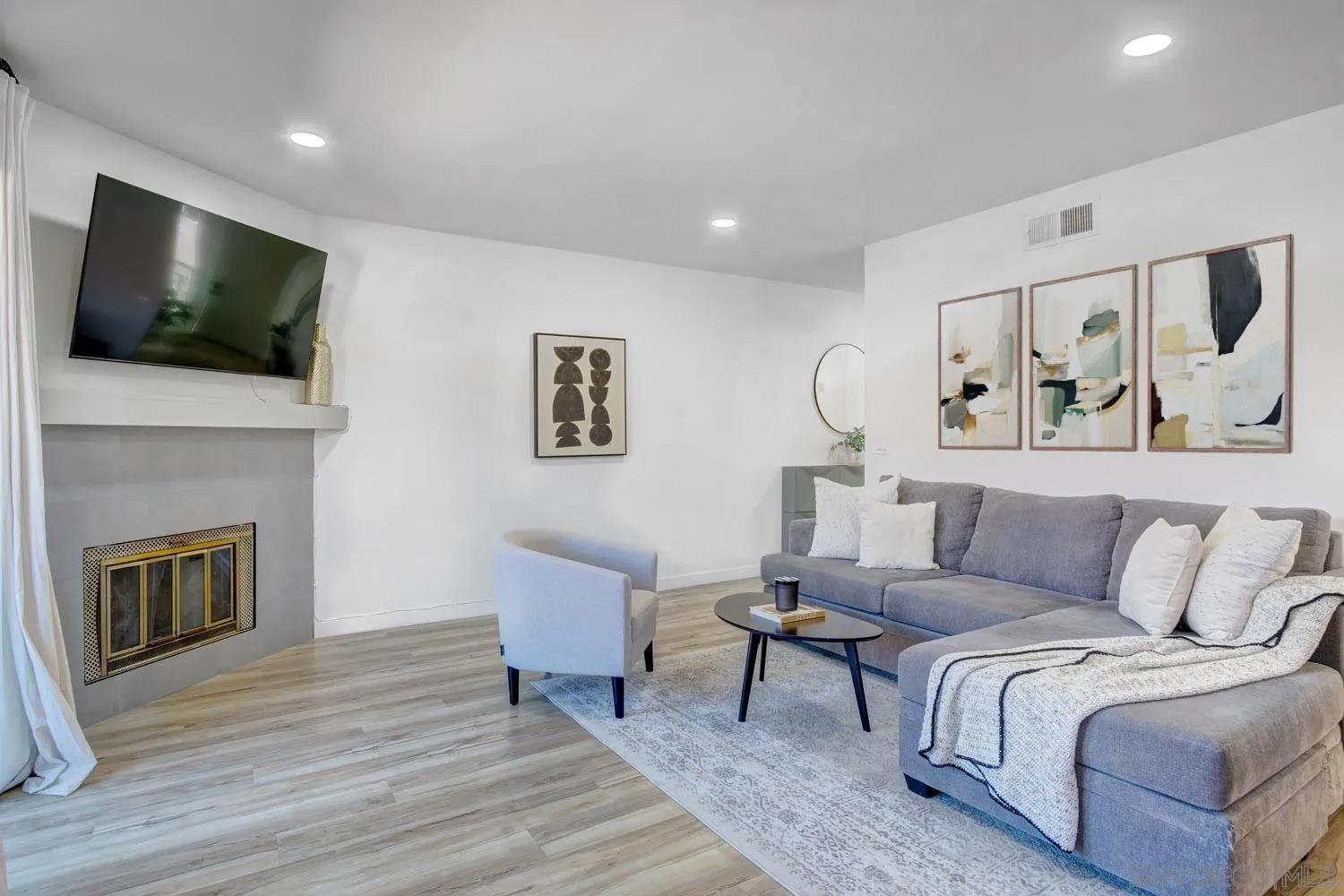 10784 Tamar Terrace, Unit C Santee, CA 92071 - Photo 6 of 33 a living room with furniture and a flat screen tv