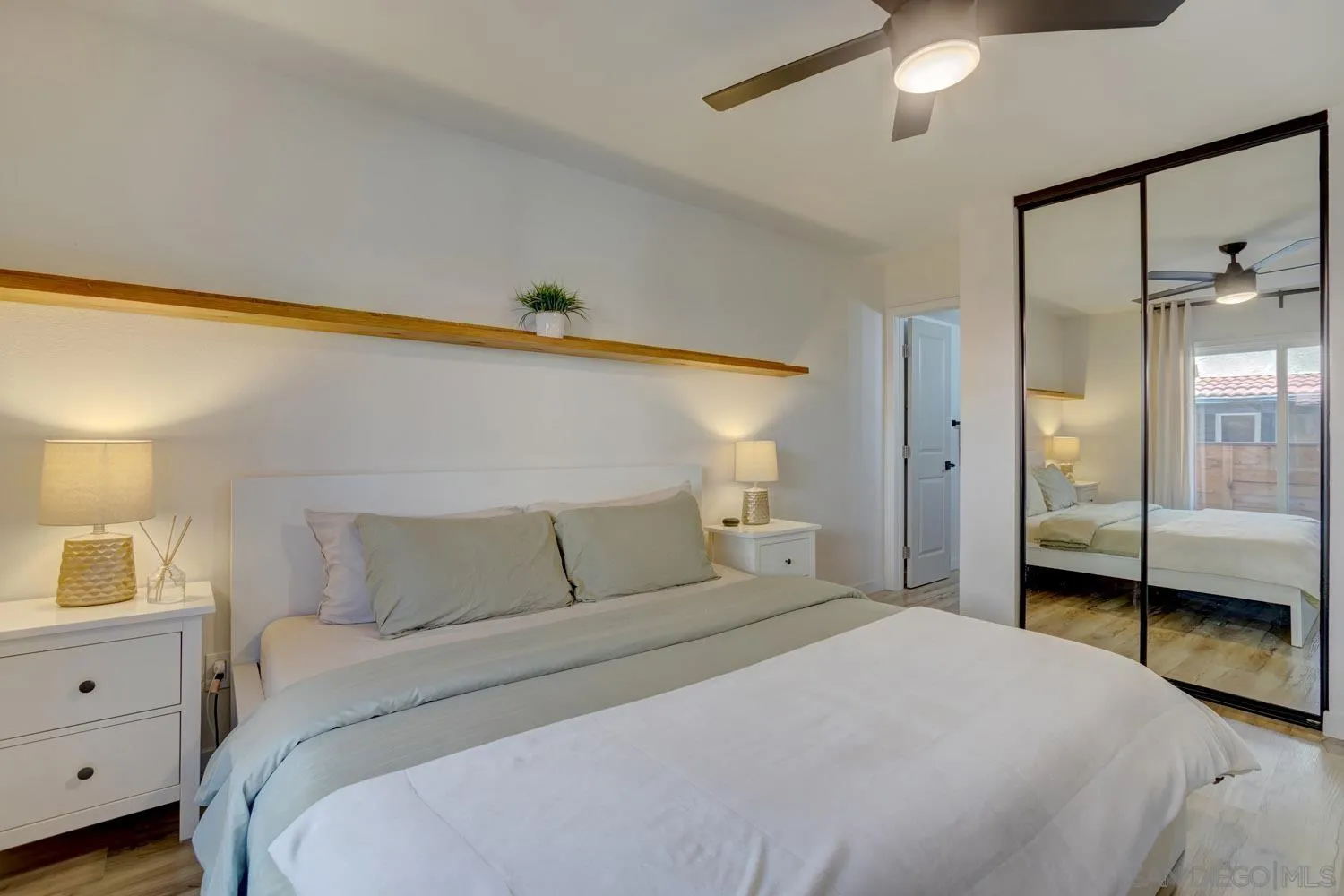 10784 Tamar Terrace, Unit C Santee, CA 92071 - Photo 9 of 33 a bedroom with a bed and a closet