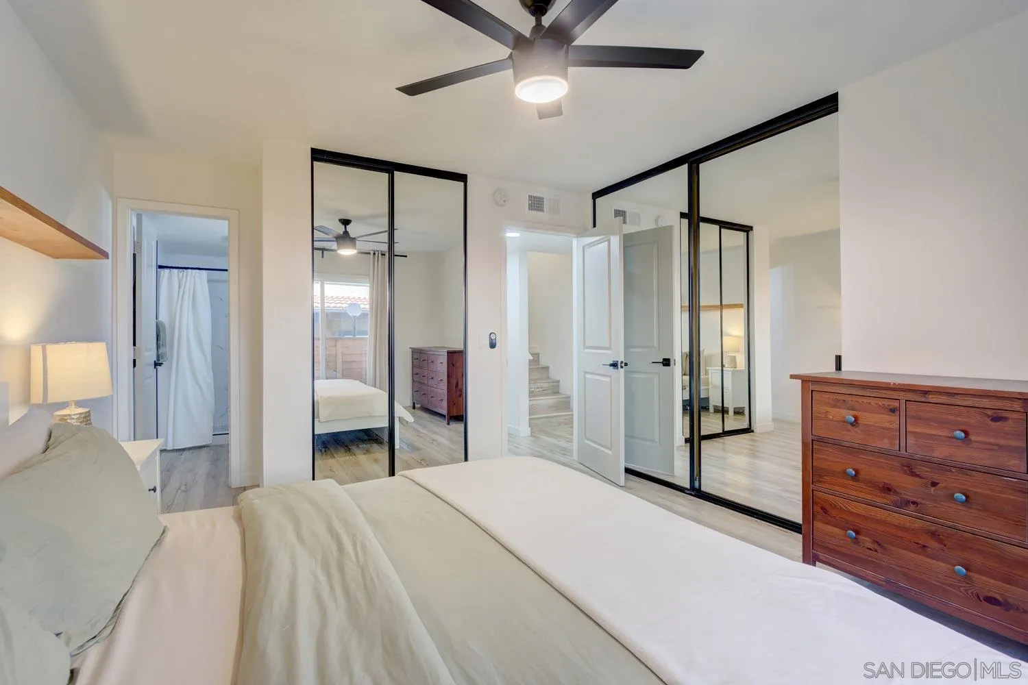 10784 Tamar Terrace, Unit C Santee, CA 92071 - Photo 10 of 33 a bedroom with a bed and a mirror on dresser