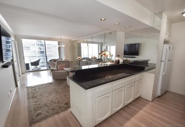 a kitchen with a sink and a stove top oven