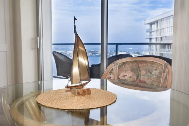 a view of a dining room with furniture and a chandelier
