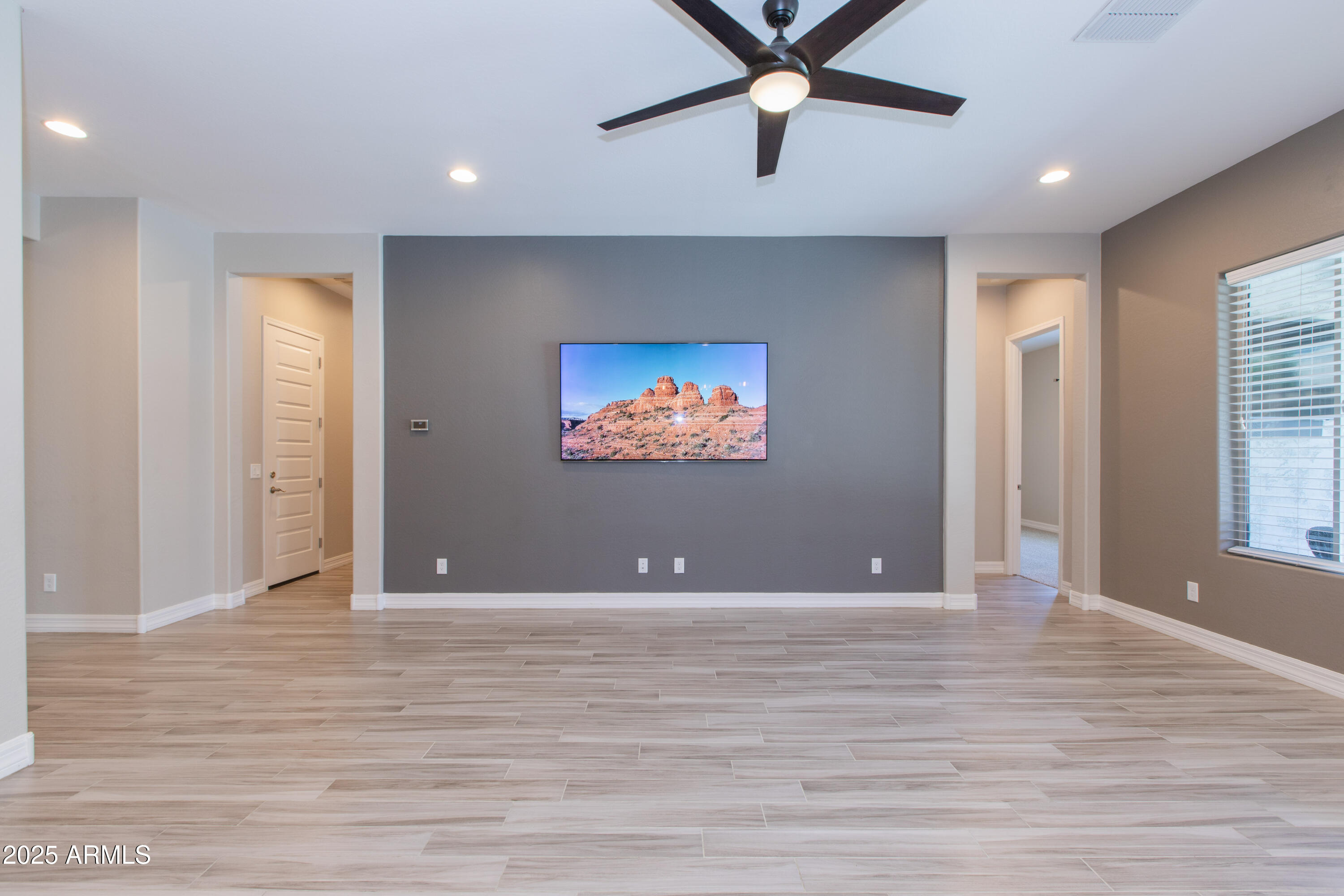 20084 Rosa Road Queen Creek, AZ 85142 - Photo 22 of 53 an empty room with wooden floor and windows