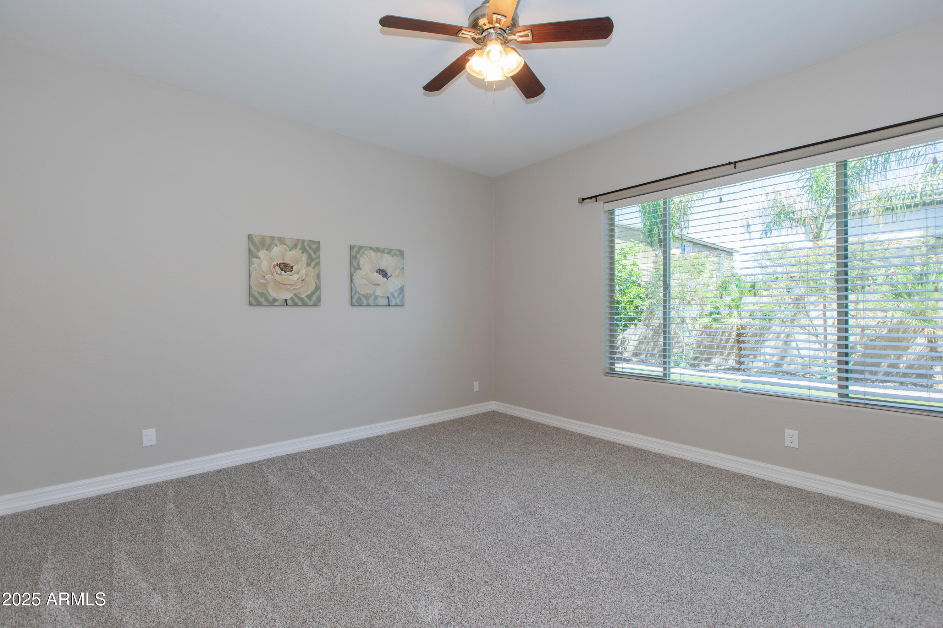 20084 Rosa Road Queen Creek, AZ 85142 - Photo 23 of 53 a view of an empty room with a window