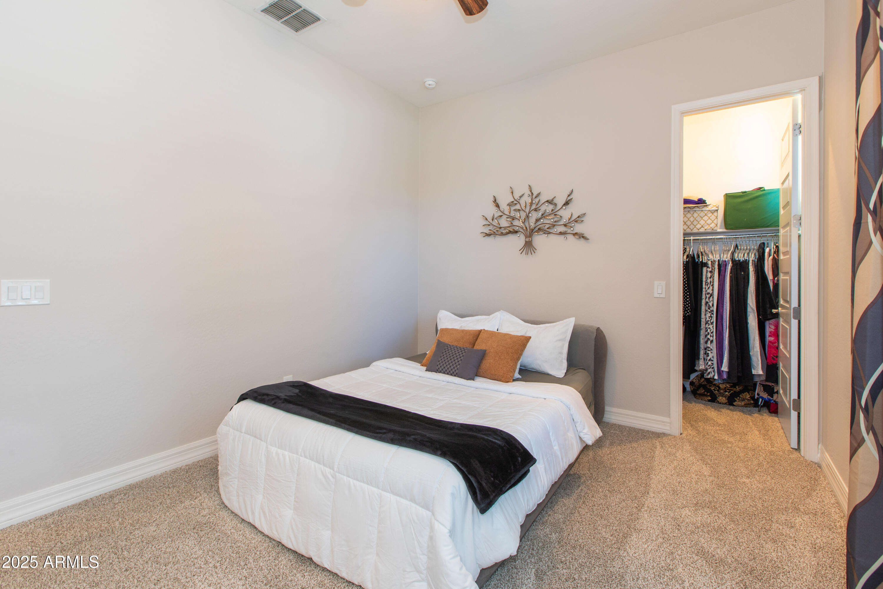 20084 Rosa Road Queen Creek, AZ 85142 - Photo 33 of 53 a bedroom with a bed and a chandelier
