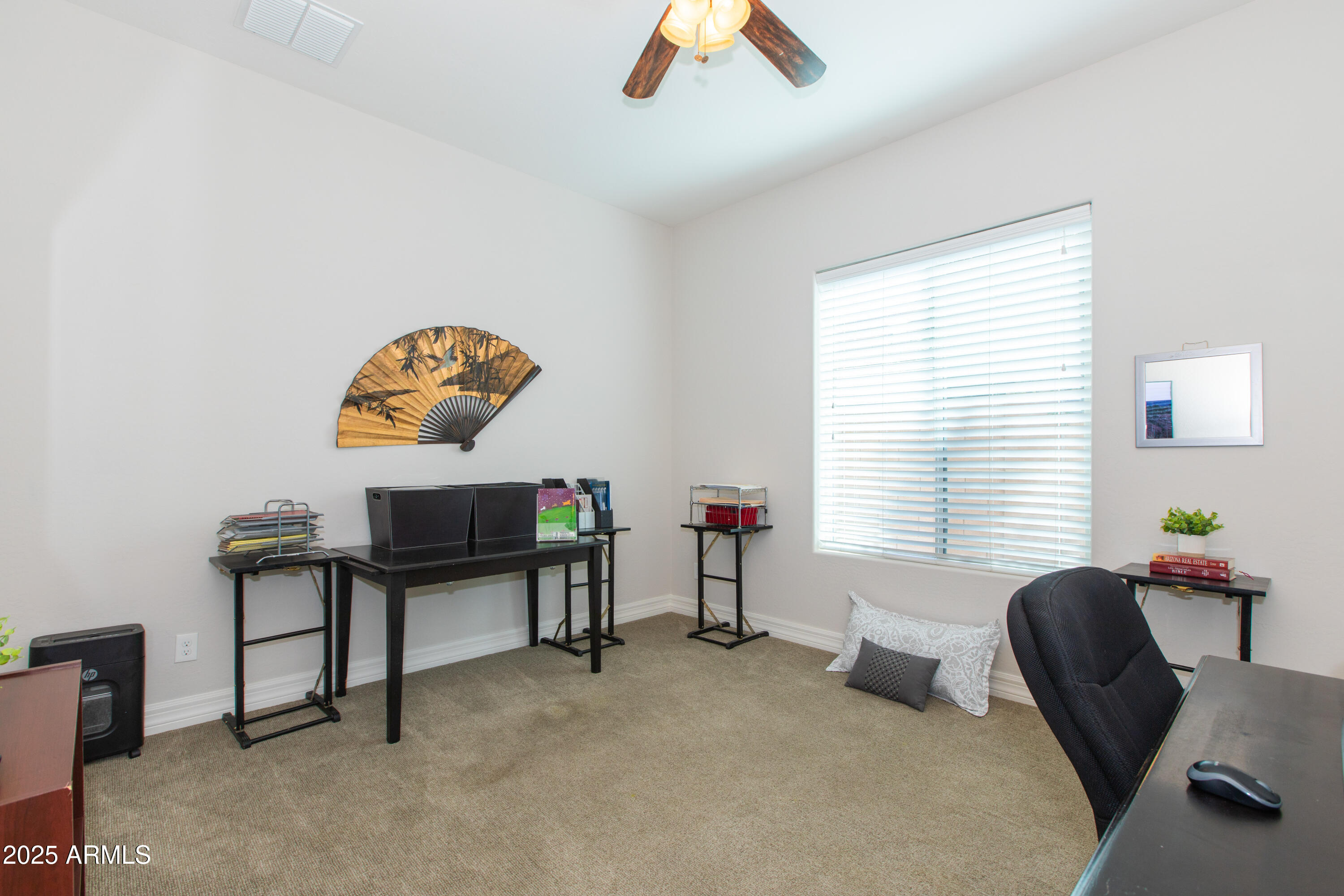 20084 Rosa Road Queen Creek, AZ 85142 - Photo 35 of 53 a view of a workspace with furniture and a window