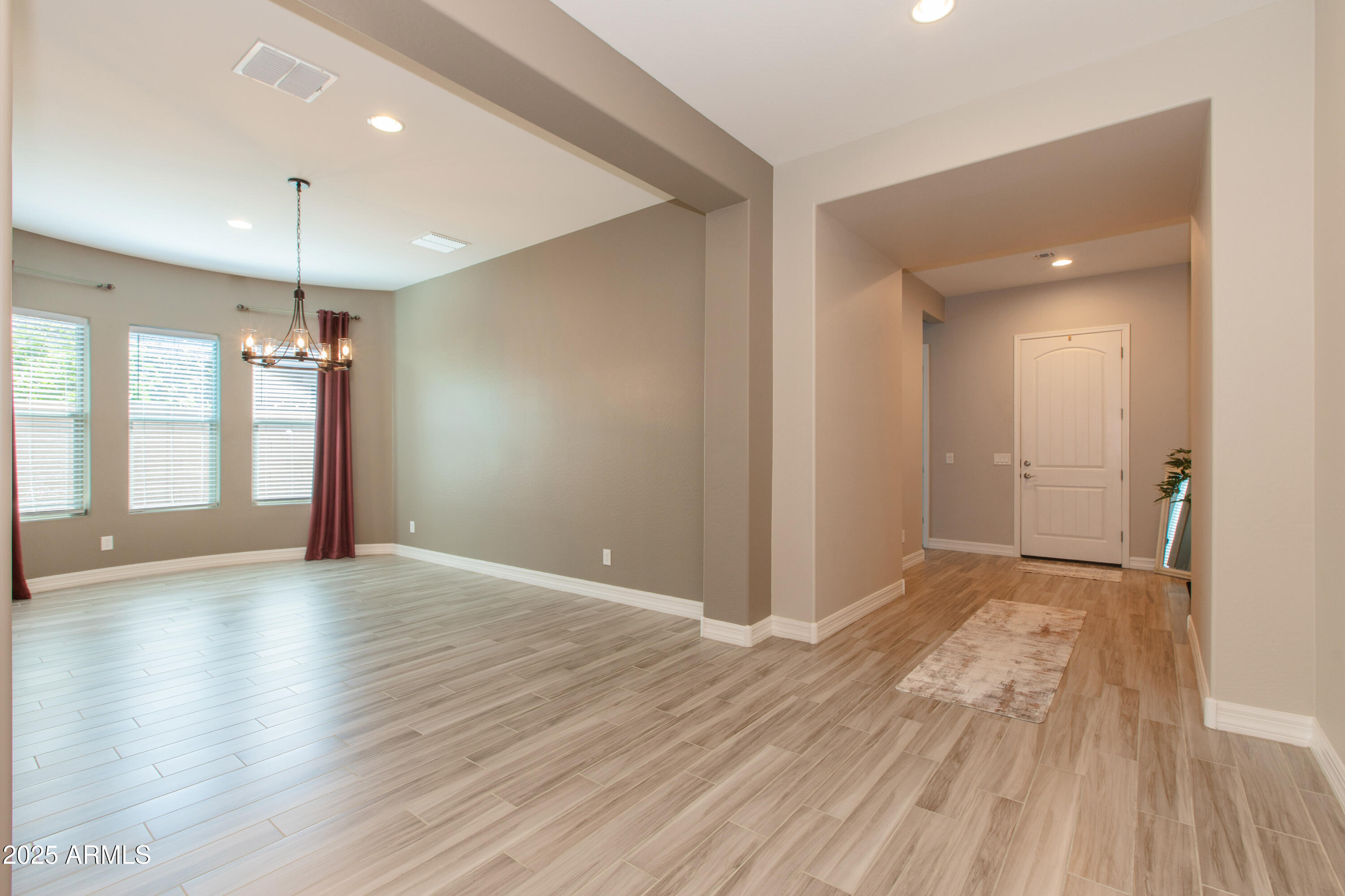 20084 Rosa Road Queen Creek, AZ 85142 - Photo 7 of 53 a view of empty room with wooden floor