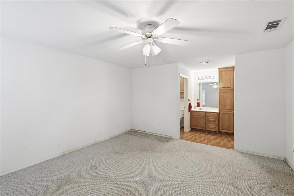 11320 Willow Springs Road Haslet, TX 76052 - Photo 12 of 28 wooden floor in an empty room and a bathroom