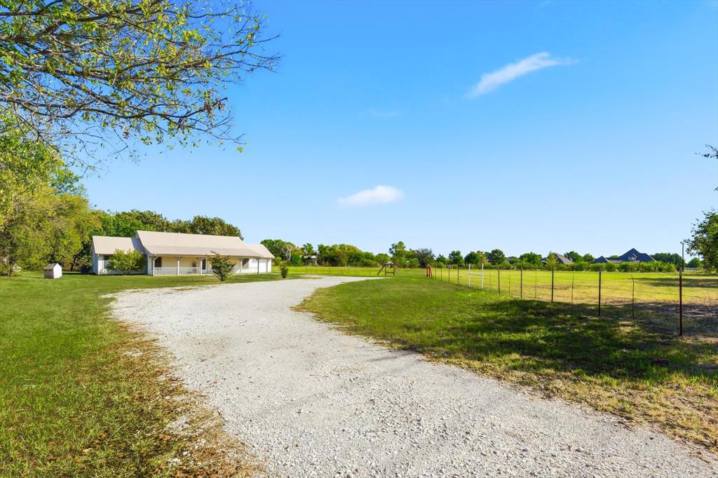 11320 Willow Springs Road Haslet, TX 76052 - Photo 20 of 28 a view of a lake with houses in the background