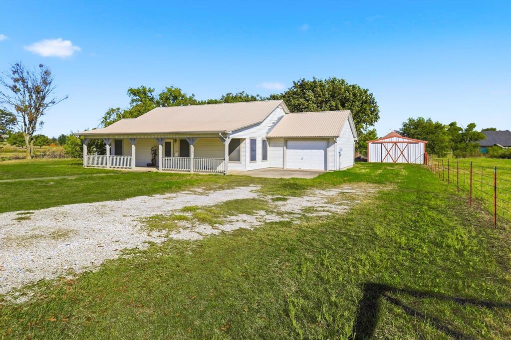 11320 Willow Springs Road Haslet, TX 76052 - Photo 4 of 28 a view of a house with a yard
