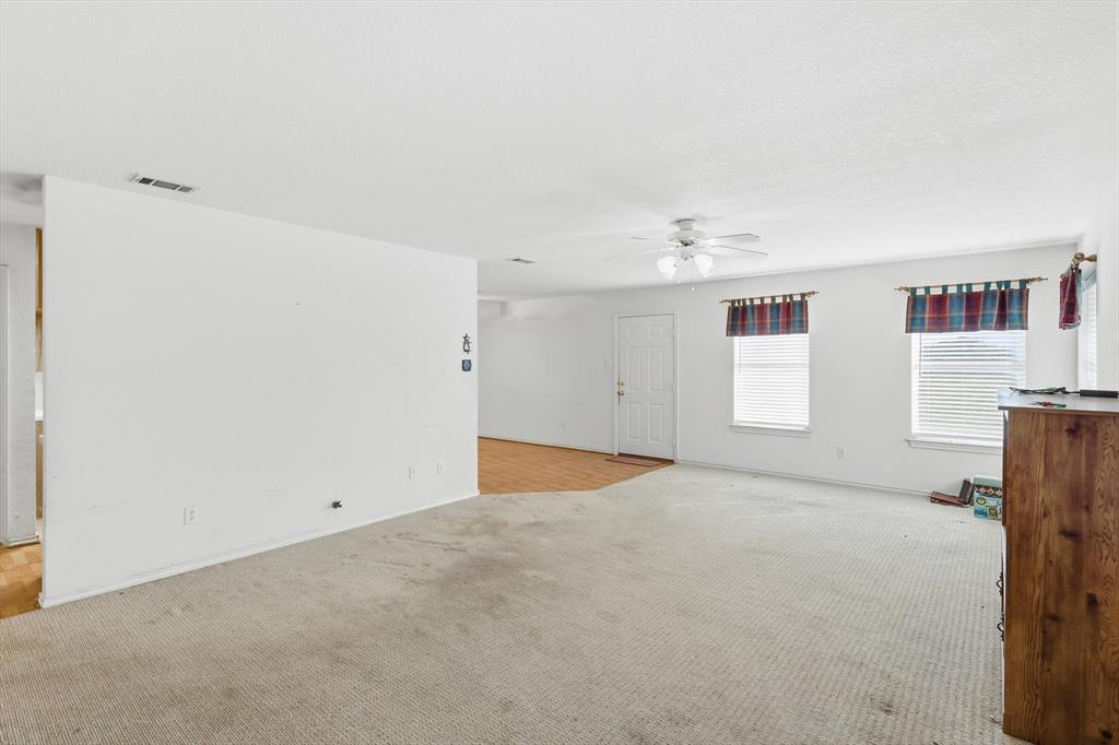 11320 Willow Springs Road Haslet, TX 76052 - Photo 6 of 28 a view of an empty room with a window