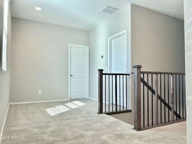 a view of a livingroom with stairs