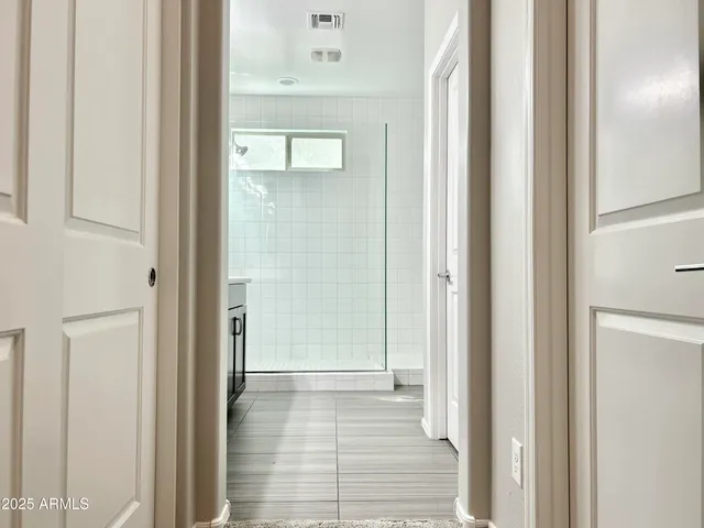 a view of a bedroom from a hallway