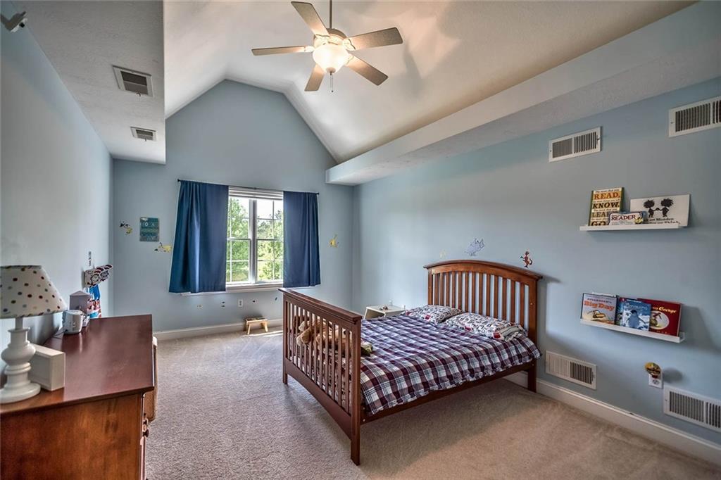 167 Pinkerton Road Wexford, PA 15090 - Photo 15 of 25 The cathedral ceiling adds an open and airy atmosphere to the second bedroom.