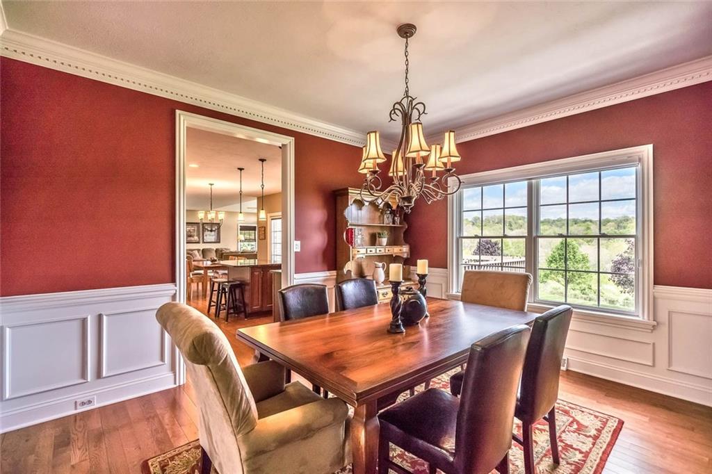 167 Pinkerton Road Wexford, PA 15090 - Photo 4 of 25 The dining room with dentil crown molding and wainscoting is the picture of elegance.