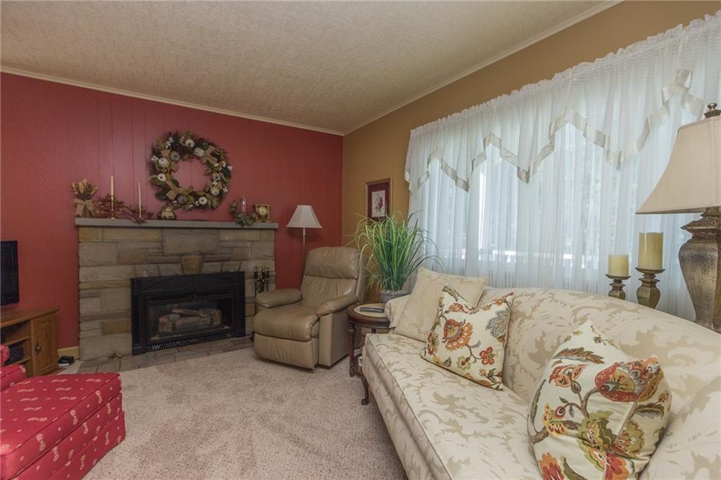 681 Goettman Drive Rochester, PA 15074 - Photo 23 of 24 GAS FIREPLACE ADDS WARMTH TO THIS LIVING ROOM