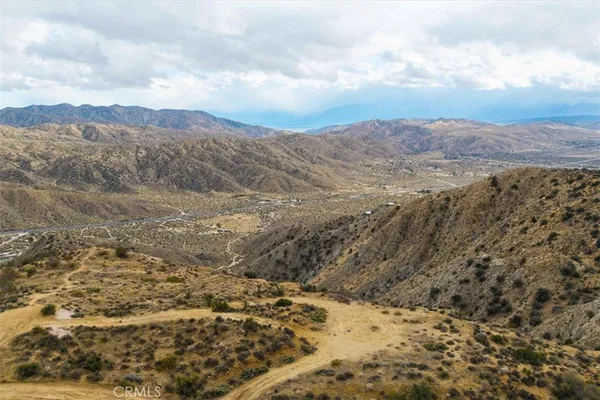 a view of mountain view with mountains in the background
