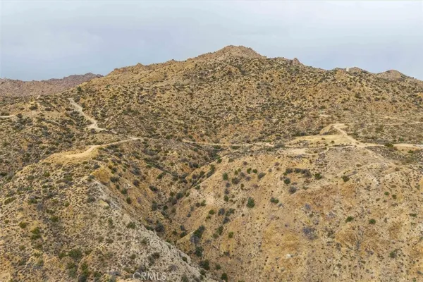 an aerial view of houses with city view